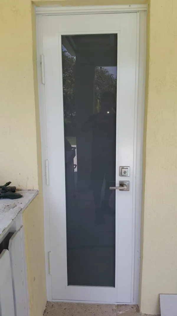 Impact windows and doors - white frame door.