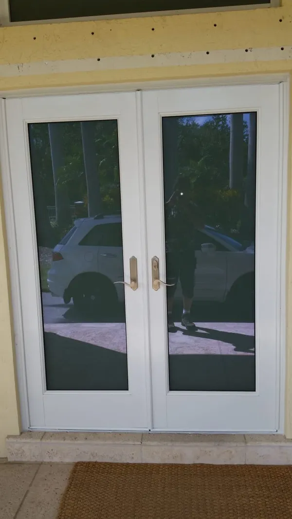 Impact windows and doors - white frame door.