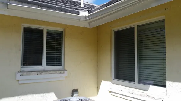 Impact windows and doors - two impact windows adjacent from each other.
