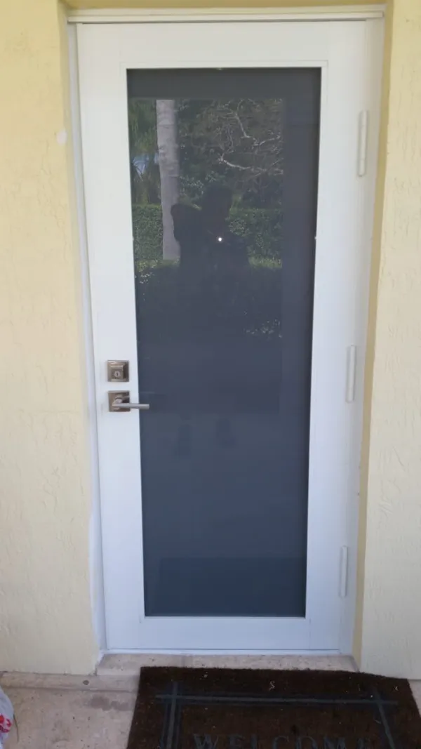 Impact windows and doors - white door frame.