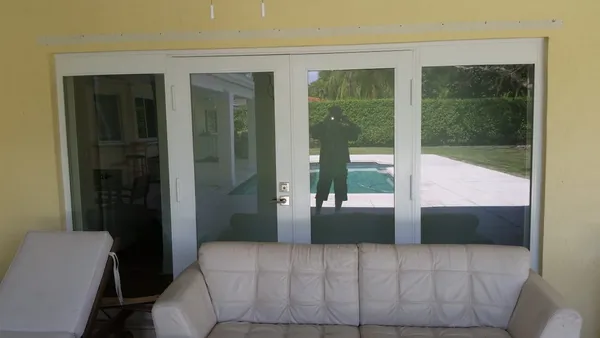 Impact windows and doors - sliding door with window attachment outdoor view.