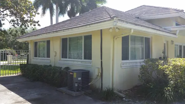Impact windows and doors 3 windows exterior home view.