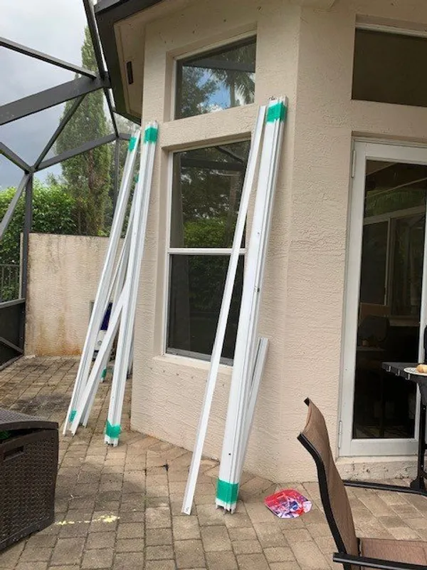 Accordion shutter installation in progress