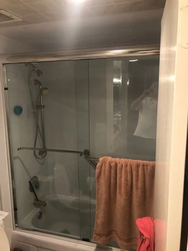 example of by-pass showers with towels hanging dry