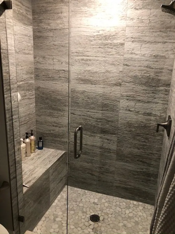 grey slate tile in frameless showers
